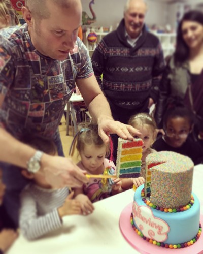Rainbow cake cutting